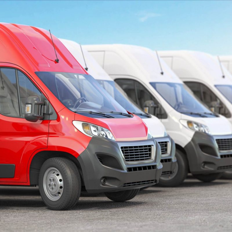 campac-red-delivery-van-in-a-row-of-white-vans-best-expr-2021-04-06-15-31-54-utc